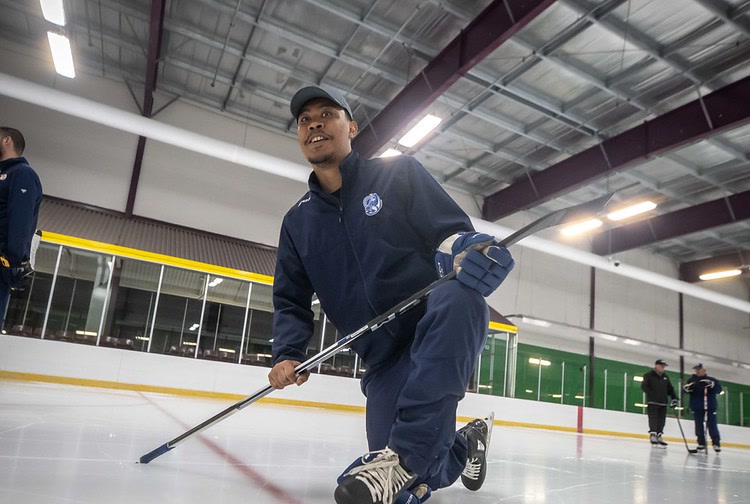 Chris Beckford-Tseu coaching a goalie on the ice